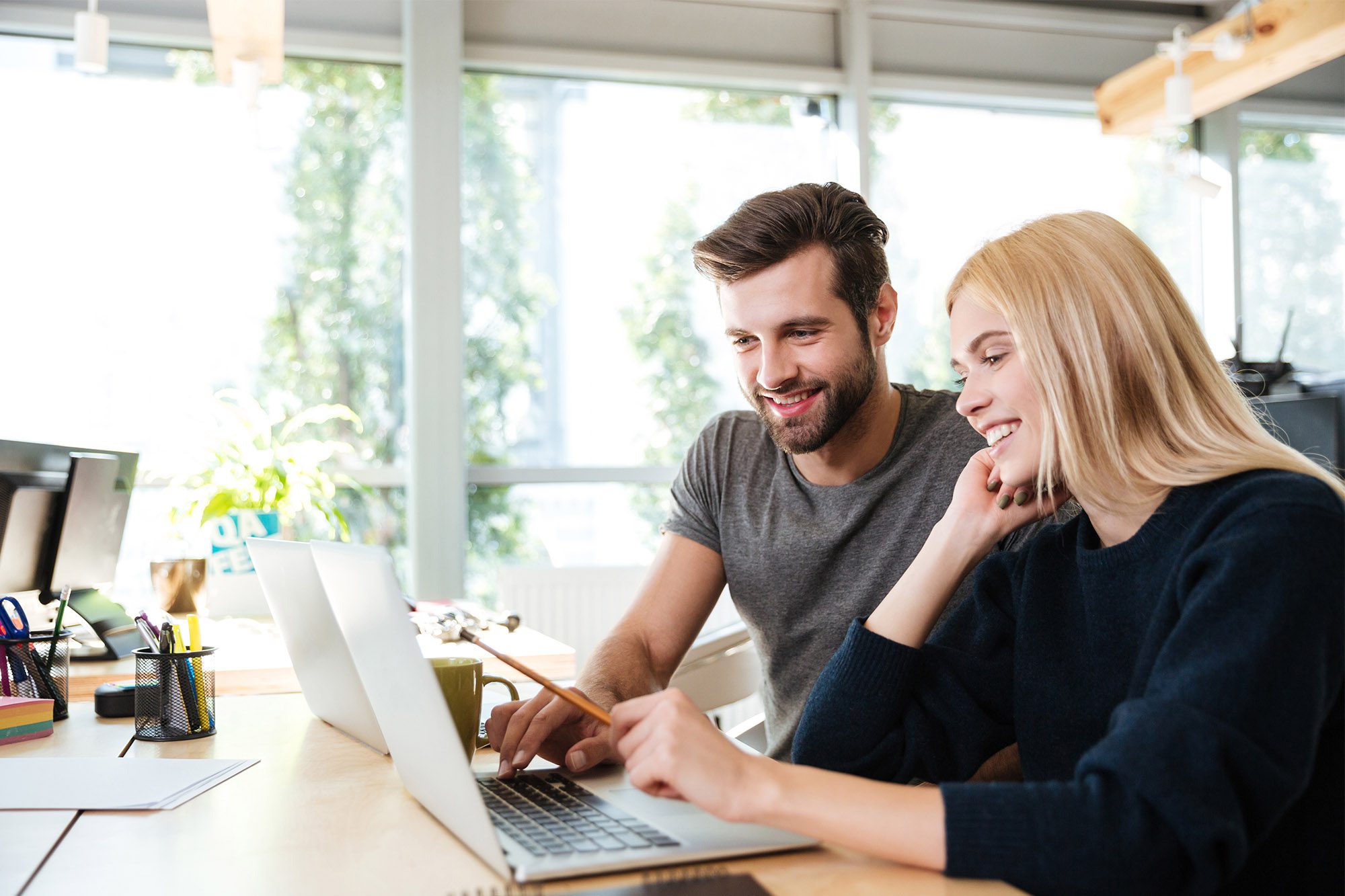 People looking at a computer