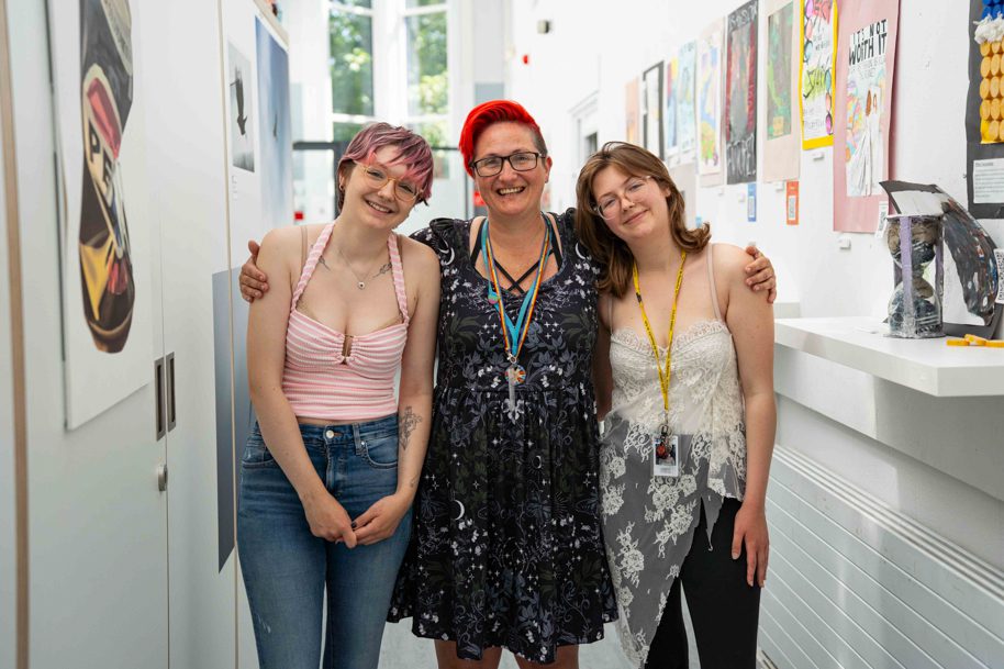 Parent and children all studying Higher education courses smiling