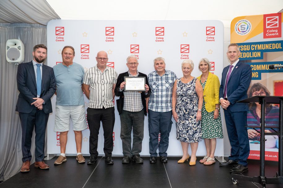 Adult learners receiving an award